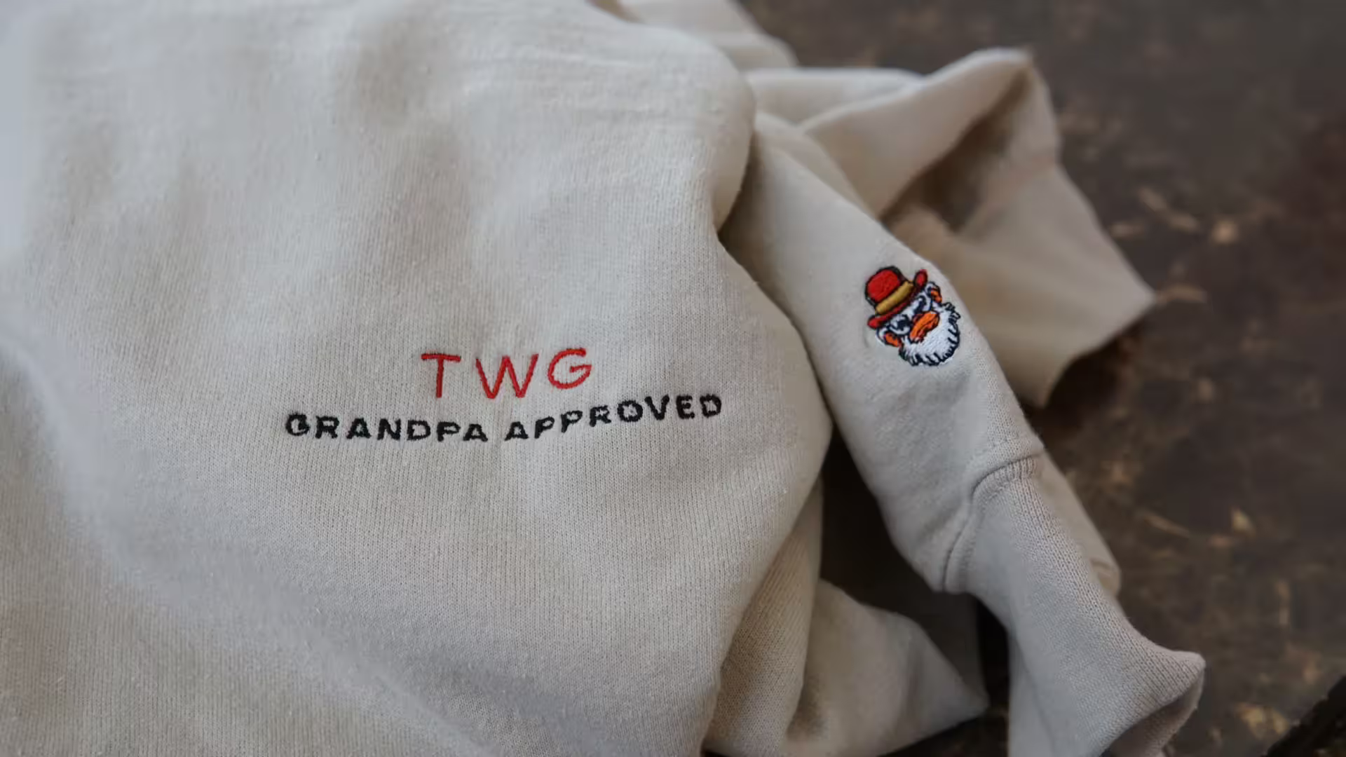 Chest and Wrist logo on sand sweater
